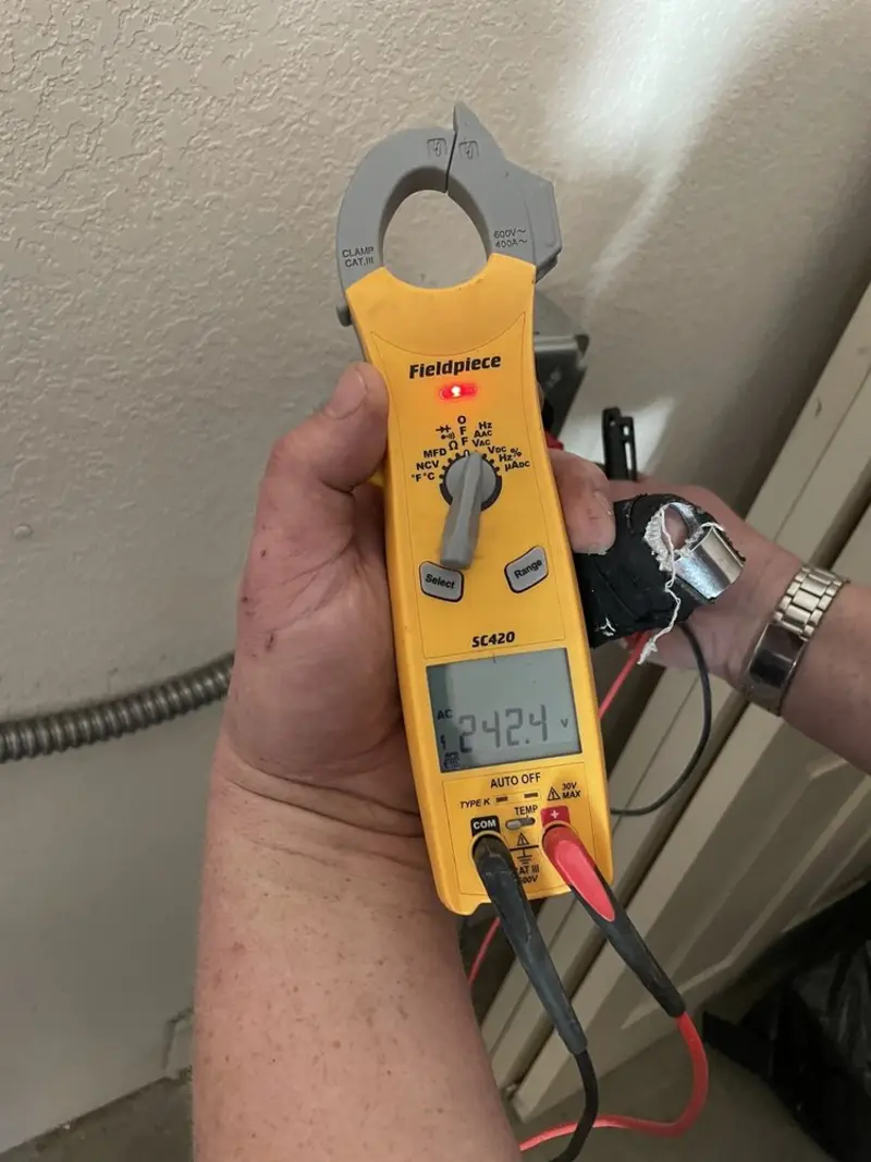 Voltage testing with clamp meter during Ceiling Fan Installation in McKenzie